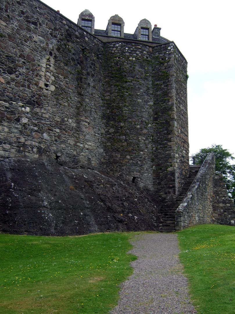 Dunstaffnage Castle, an impressive but grim old ruinous walled castle, long held by the Campbells, with later tower and atmospheric chapel in a wooded spot near Oban in Argyll.