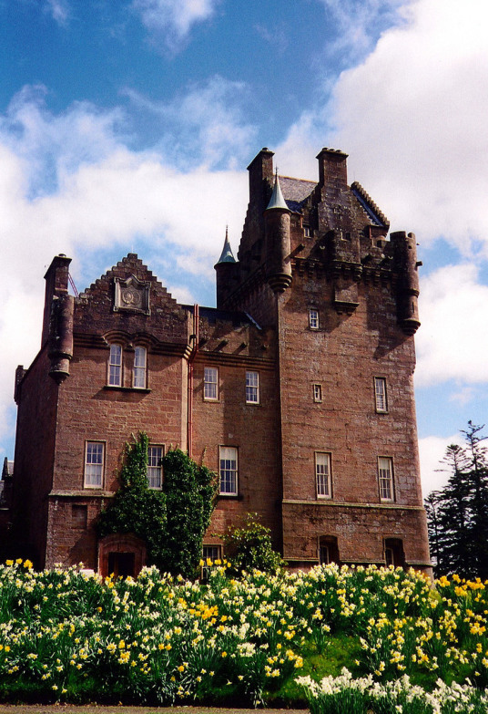 Brodick Castle, a large and attractive old stronghold and later mansion, standing in a prominent spot in colourful gardens and grounds near Brodick on the island of Arran in western Scotland, and held by the powerful Hamiltons.