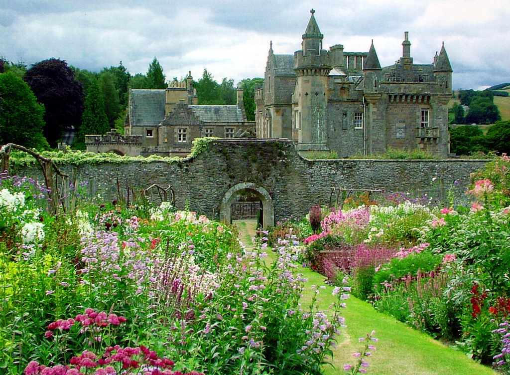 Abbotsford House, the home of Sir Walter Scott, the famous author, and stands in fine wooded grounds and gardens by the River Tweed, near Tweedbank, Melrose and Galashiels in the Borders of Scotland.