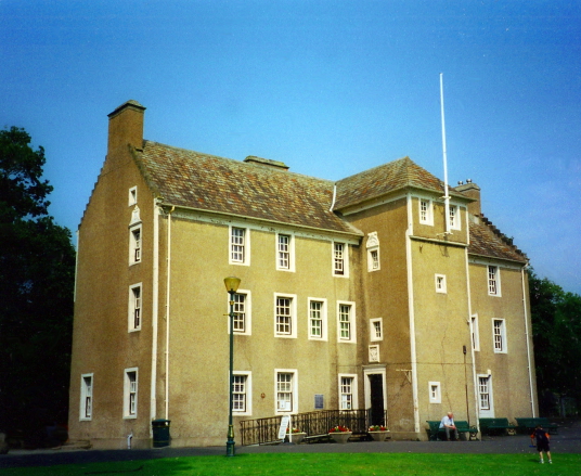Pittencrieff House, an imposing orange-washed old house, standing in the picturesque Pittencrieff Park in Dunfermline in Fife and associated with Andrew Carnegie.
