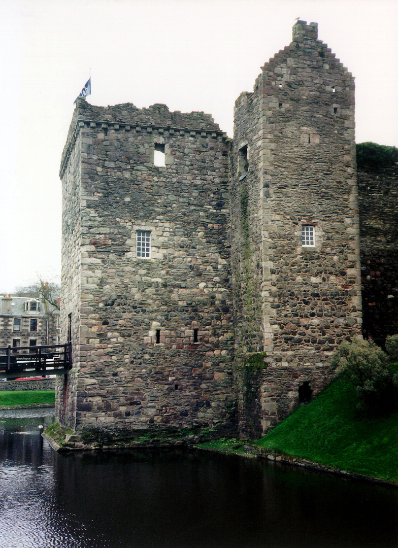 Rothesay Castle, an unusual round but ruinous old stronghold with an impressive gatehouse and protected by a wet moat, standing in Rothesay on the island of Bute and royal residence of Robert II and Robert, kings of Scots.