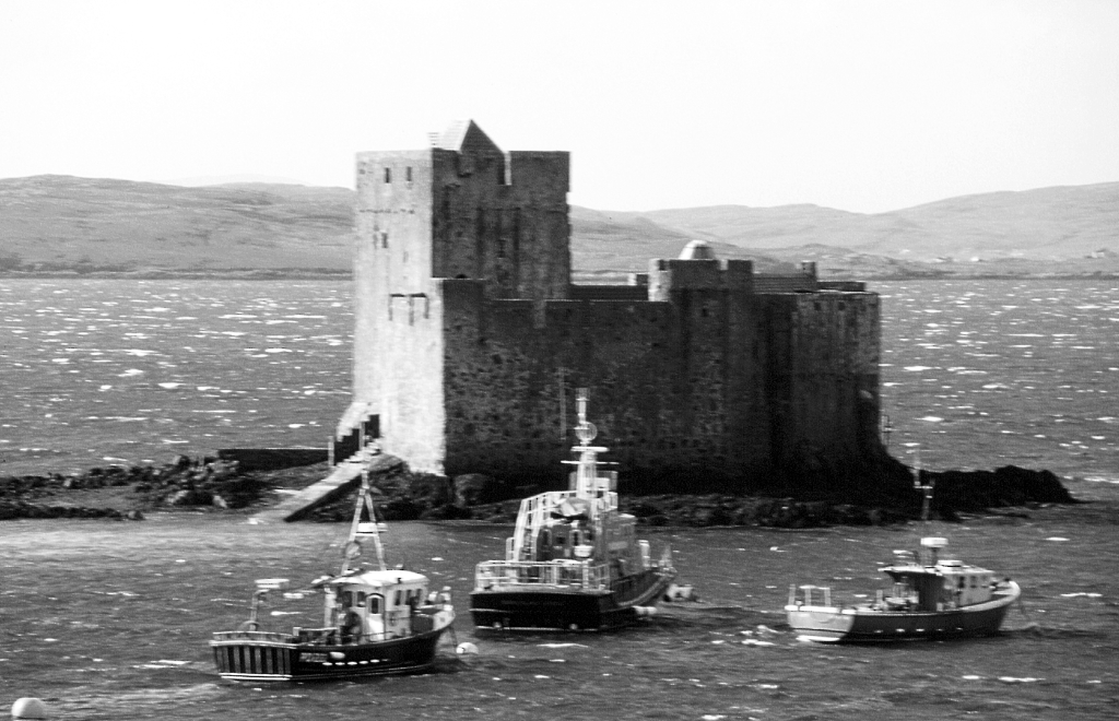 Kisimul Castle is a picturesque old partly ruinous stronghold of the MacNeills of Barra, located on an island in Castlebay on the scenic Hebridean island of Barra in western Scotland.