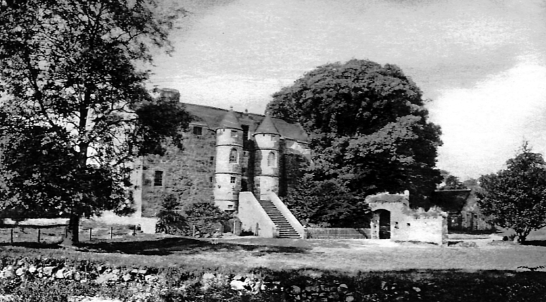 Rowallan Castle, an impressive old stronghold with a drum-towered entrance of the Mure family in landscaped grounds near Kilmarnock in Ayrshire.