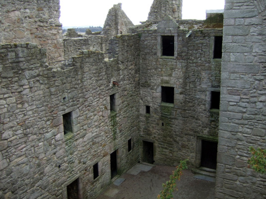 Courtyard of Craigmillar Castle, a grand but ruinous castle with a large tower and two courtyards, held by the Prestons and the Gilmours, and associated with Mary Queen of Scots, in the Craigmillar area of Edinburgh.