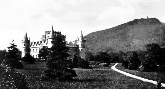 Inverary Castle, a magnificent towered mansion, the seat of the Campbell Dukes of Argyll and located among colourful gardens in a beautiful spot by Loch Fyne near the attractive burgh of Inveraray in Arygll.