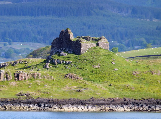 Ardtornish Castle, a shattered old medieval stronghold of the MacDonald Lords of the Isles, in a beautiful spot on the north bank of the Sound of Mull near Lochaline in the Highlands of Scotland.