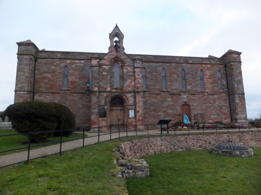 Coldingham Priory was a rich monastic establishment but all the survives is the impressive choir of the former priory standing in a scenic location in the interesting graveyard with many old memorials in the picturesque village of Coldingham in Berwickshi