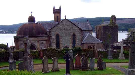 Kilmun, Inverary Castle, a magnificent towered mansion, the seat of the Campbell Dukes of Argyll and located among colourful gardens in a beautiful spot by Loch Fyne near the attractive burgh of Inveraray in Arygll.