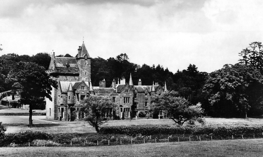 Guthrie Castle, an attractive old tower house and later mansion, long held by the Guthrie family and now and set in wooded grounds, near Forfar in Angus in northeast Scotland.