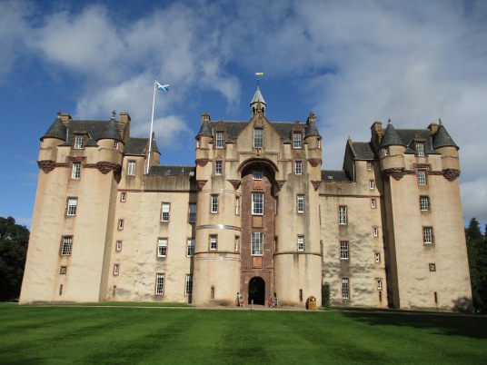 Fyvie Castle, a large and sumptuous old castle, held successively by the Lindsays, Prestons, Meldrums, Setons, Gordons and then Leiths, with an impressive interior, set in beautiful gardens and landscaped policies, near Rothienorman in Aberdeeenshire in n