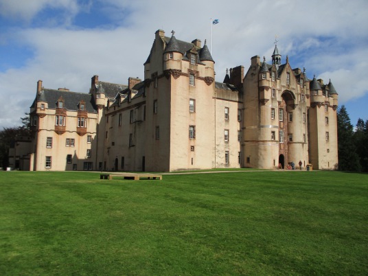 Fyvie Castle, a large and sumptuous old castle, held successively by the Lindsays, Prestons, Meldrums, Setons, Gordons and then Leiths, with an impressive interior, set in beautiful gardens and landscaped policies, near Rothienorman in Aberdeeenshire in n