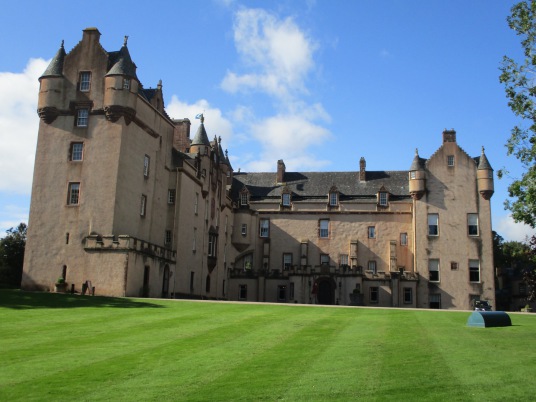 Fyvie Castle, a large and sumptuous old castle, held successively by the Lindsays, Prestons, Meldrums, Setons, Gordons and then Leiths, with an impressive interior, set in beautiful gardens and landscaped policies, near Rothienorman in Aberdeeenshire in n