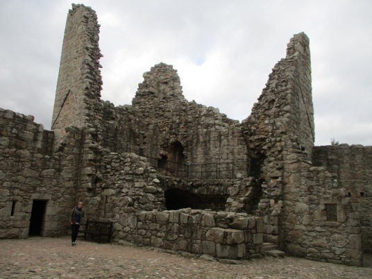 Ruin of tower, Tolquhon Castle is a substantial ruinous courtyard castle with a large tower and some fantastic stone carving on the gatehouse, held by the Preston family and then by the Forbeses, in a quiet spot near Tarves (Tarves Tomb) in Aberdeenshire