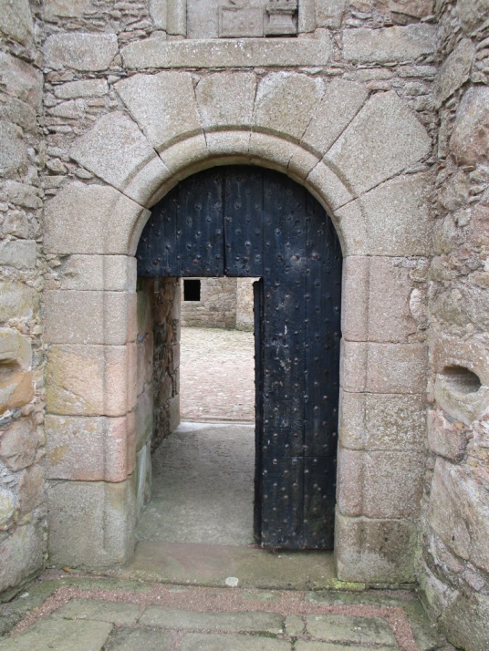 Entrance, Tolquhon Castle is a substantial ruinous courtyard castle with a large tower and some fantastic stone carving on the gatehouse, held by the Preston family and then by the Forbeses, in a quiet spot near Tarves (Tarves Tomb) in Aberdeenshire