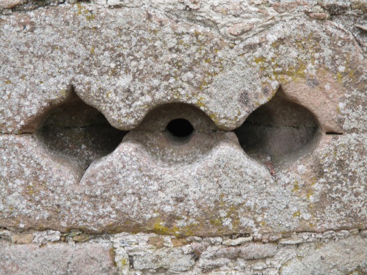 Elaborate gunloop, Tolquhon Castle is a substantial ruinous courtyard castle with a large tower and some fantastic stone carving on the gatehouse, held by the Preston family and then by the Forbeses, in a quiet spot near Tarves (Tarves Tomb)
