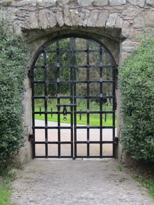 Yett, Outer Courtyard, Tolquhon Castle is a substantial ruinous courtyard castle with a large tower and some fantastic stone carving on the gatehouse, held by the Preston family and then by the Forbeses, in a quiet spot near Tarves (Tarves Tomb)