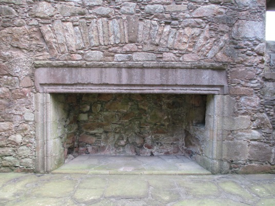 Fireplace, Tolquhon Castle is a substantial ruinous courtyard castle with a large tower and some fantastic stone carving on the gatehouse, held by the Preston family and then by the Forbeses, in a quiet spot near Tarves (Tarves Tomb) in Aberdeenshire