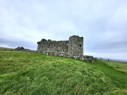 Muness Castle is the most northerly castle in Britain, and is a fine impressive ruin in a quiet and lonely spot on the island of Unst in the Shetland islands in the far north of Scotland, once home to the Bruces, incomers to Shetland.